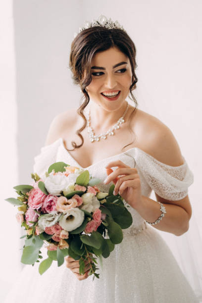 istock black-haired bride girl getting ready for groom in boudoir 2177264926