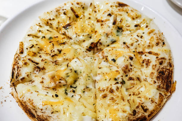 istock close up of five cheese pizzas on a white plate 2177267262