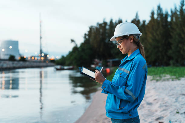 istock Female engineer works overtime at petroleum refinery. 2177267545