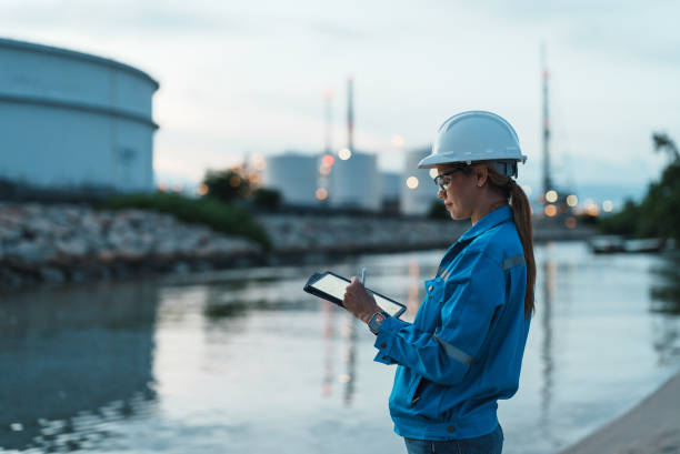 istock Female engineer works overtime at petroleum refinery. 2177267684