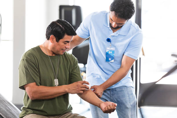 istock Male soldier learns how to use massage ball on arm 2177267688