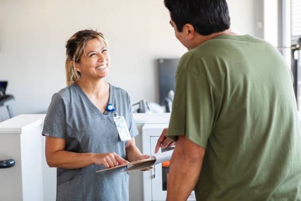Female occupational therapist discusses treatment plan with unrecognizable man