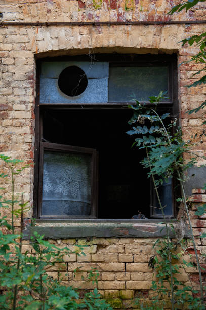 istock Old wooden window on the ancient abandoned house 2177269021
