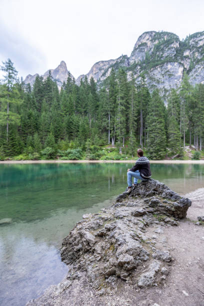 istock A man relaxing by an alpine lake in summer 2177270939