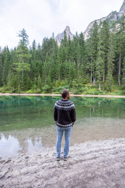 istock Man Admiring Mountain Lake Scenery 2177271112