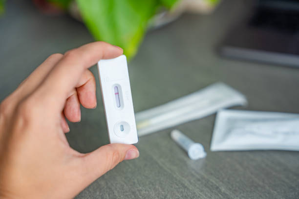istock Rapid Antigen Test kit with with negative result during swab COVID-19 testing. Coronavirus Self nasal or Home test, Autumn exacerbation of viruses 2177272983