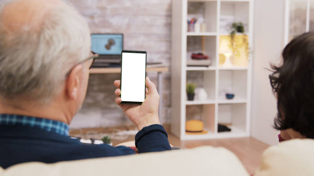istock Back view of elderly age couple holding phone 2177274574