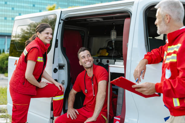 istock Team of paramedics discussing by an ambulance van 2177274730