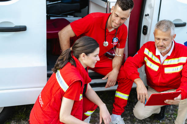 istock Paramedics discussing action plan beside emergency vehicle 2177274848