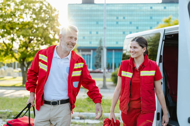 Cheerful paramedics walking outdoors on a sunny day