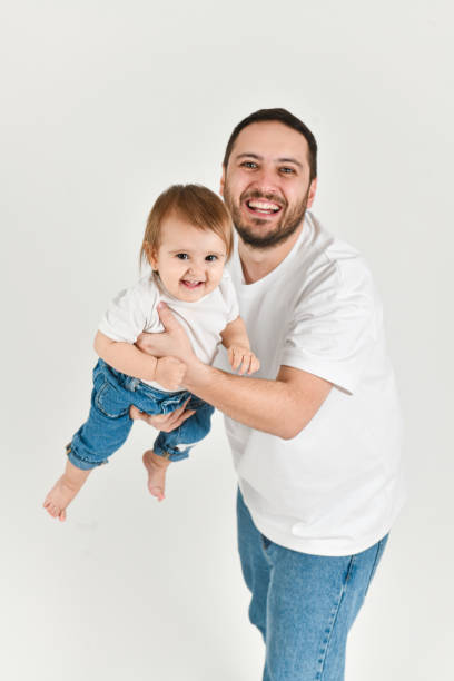 istock Laughing Single Father Playing Airplane With Daughter While Swinging Her in Air and Both are Smiling 2177276244