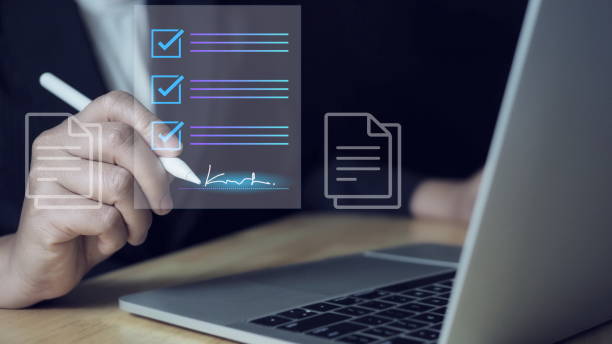 istock E-document management Paperless workplace, e-signing, electronic signature, document management man signs an electronic document on digital document by virtual notebook screen using a stylus pen. 2177278025