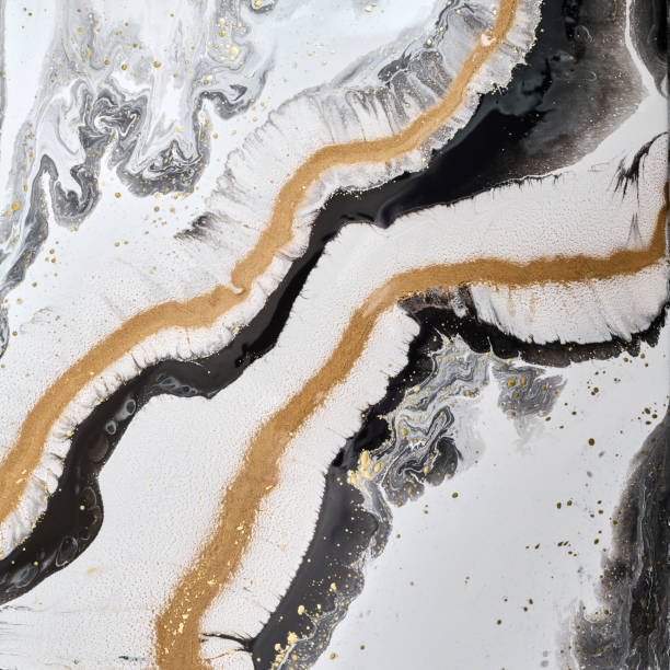 istock Abstract design with  white hues, accented by shimmering gold lines. The fluid shapes  natural mineral patterns,  a harmonious and elegant visual flow 2177278318