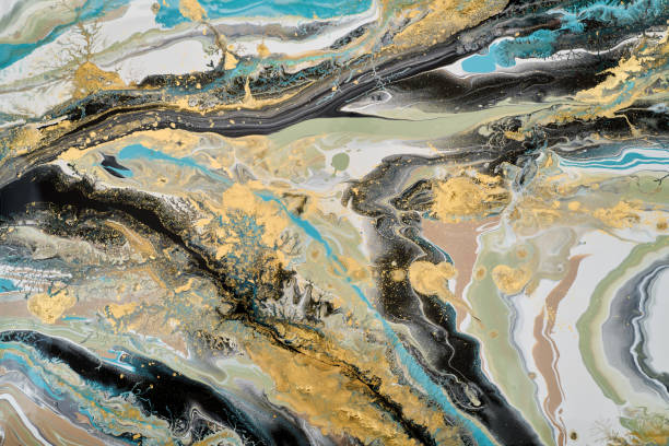 istock A fluid abstract composition featuring vibrant  gold accents,  the movement of rivers and geological patterns. The textured surfaces  depth and visual intrigue 2177278625