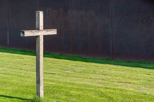 The religious cross next to the city building.