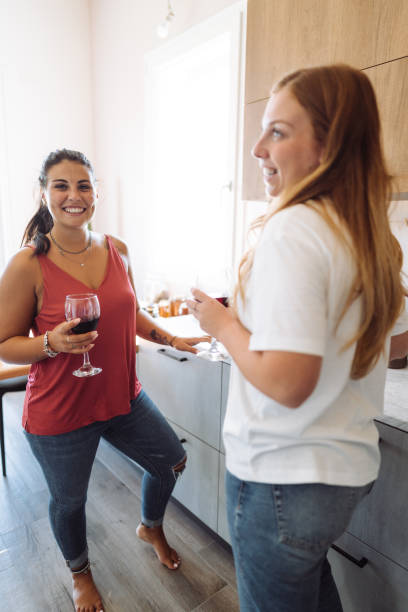 istock lesbian couple toasting at home 2177283218