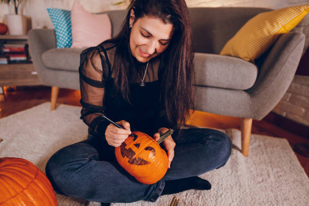 istock Woman enjoy at home while preparing Halloween 2177284147
