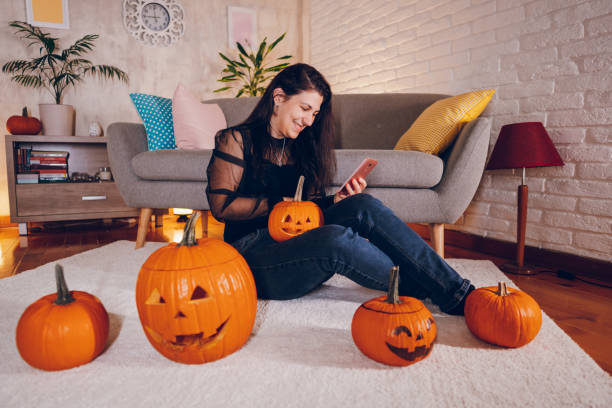 istock Woman enjoy at home while preparing Halloween 2177284457