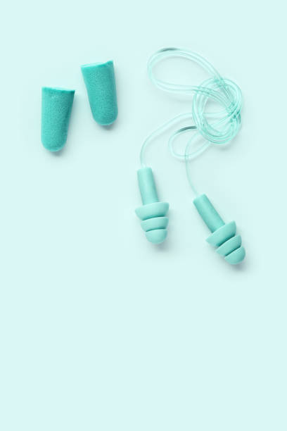 istock Different ear plugs as minimal monochrome composition, comfort silicone and rubber ear plug on string protection against noise, protect hear, for swim, sleep, rest. Top view flat lay photo 2177287438