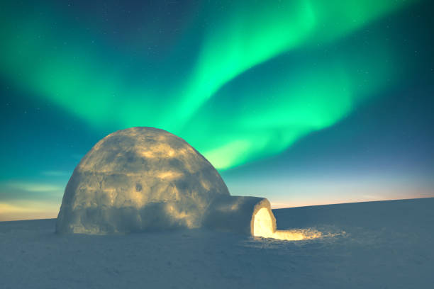 istock Wintry scene with glowing polar lights and snowy igloo 2177288576
