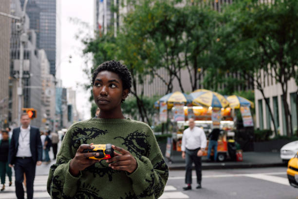 istock Young woman using a disposable camera in New York City 2177289285