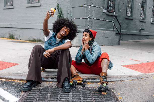 istock Young friends using a disposable camera in Williamsburg - New York City downtown 2177290429