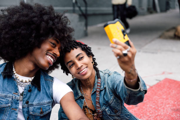 istock Selfie on Disposable Camera - Young friends using a disposable camera in Williamsburg - New York City downtown 2177290698