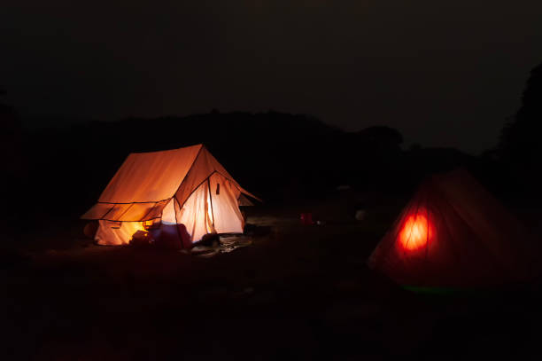istock Iluuminated from inside, trekkers camp at Varsey Rhododendron Sanctuary or Barsey Rhododendron Sanctuary, at night, Singalila Range, amidst Himalayan mountains of western Sikkim, India. 2177290882