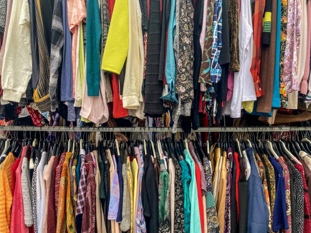 istock Colorful shirts hanging in hangers 2177292358