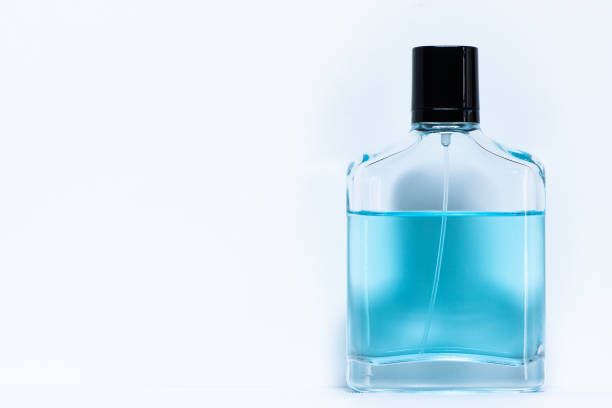 Blue Glass Perfume Bottle With A Shiny Black Cap Glimmers On A Reflective Base 3D Illustration