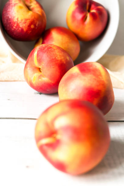 ripe nectarines. on a wooden table.