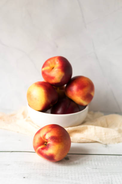 istock ripe nectarines. on a wooden table. fruits 2177297557