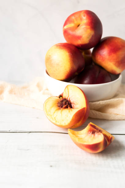 istock ripe nectarines. on a wooden table. fruits 2177297561