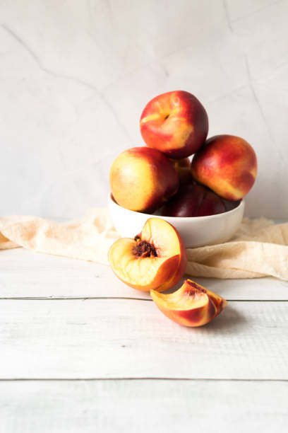 istock ripe nectarines. on a wooden table. fruits 2177297566