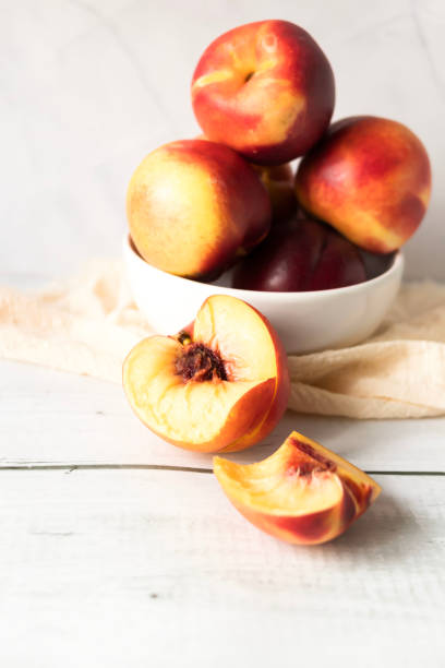 istock ripe nectarines. on a wooden table. fruits 2177297578