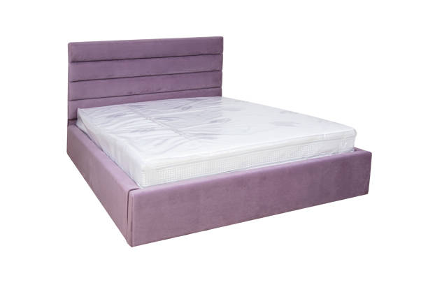 Double bed with soft headboard. Cushioned furniture.
