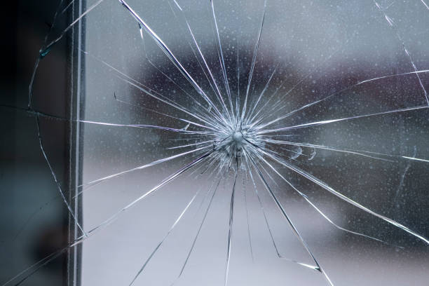 istock Cracked door glass in close-up. 2177298873