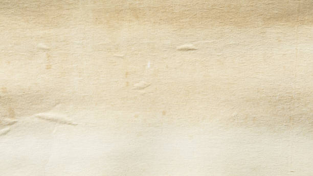 istock yellowed old canvas paper texture with brown stains 2177301932