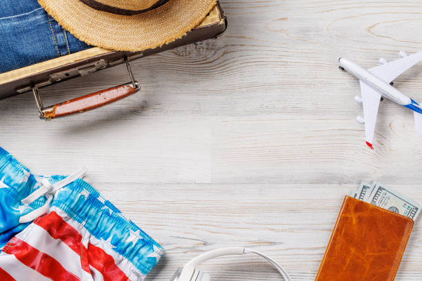 istock A travel bag with clothes, sun hat 2177302112