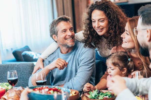 istock Family enjoy Thanksgiving lunch together 2177303143