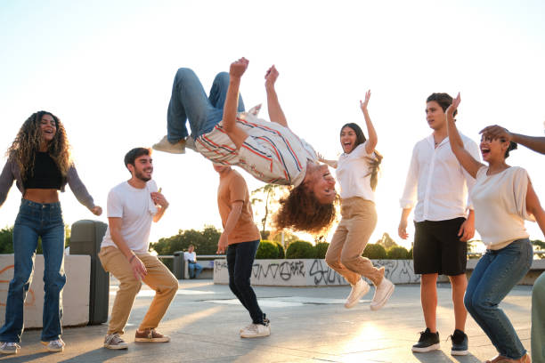istock Group of friends having fun with one doing a backflip 2177305238