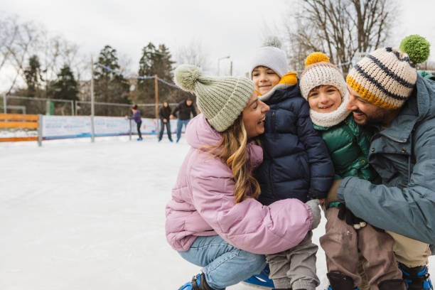 Happy family enjoying ice skate