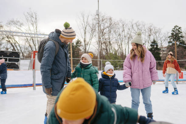 istock Happy family enjoying ice skate 2177305337