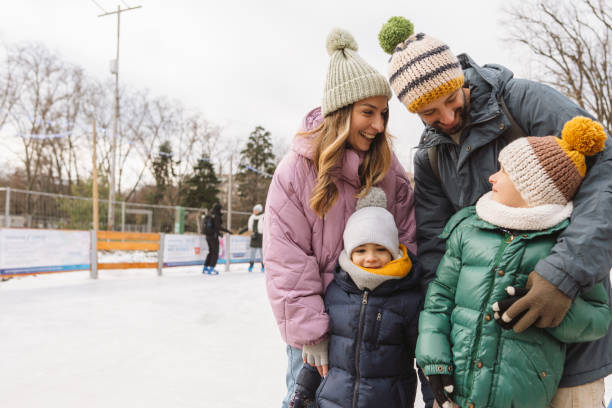 istock Happy family enjoying ice skate 2177305359