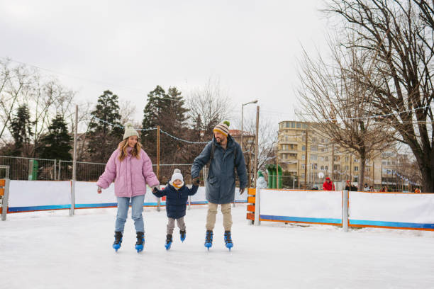 Photo of parents and son enjoying ice skating