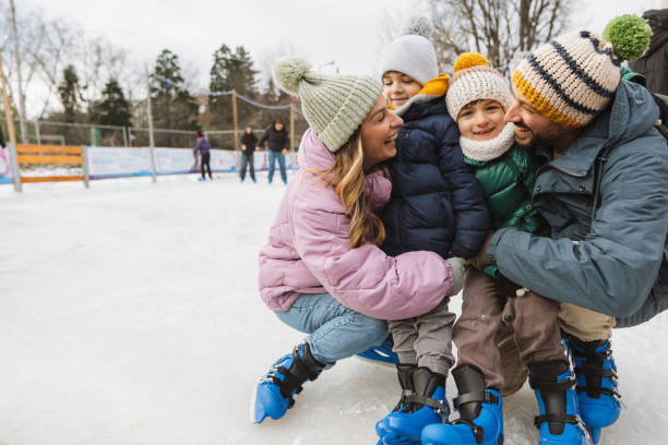 istock Happy family enjoying ice skate 2177305389