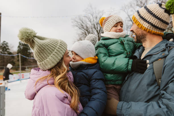 istock Happy family enjoying ice skate 2177305394