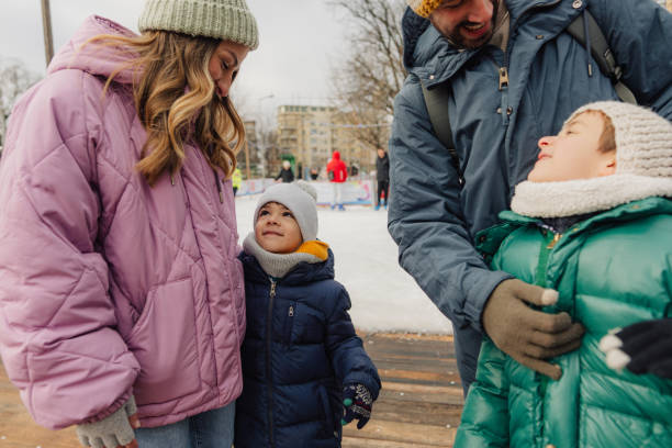 istock Happy family enjoying ice skate 2177305401