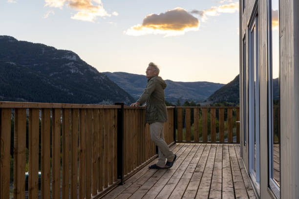 istock Mature man watches sunrise from cabin deck 2177305769