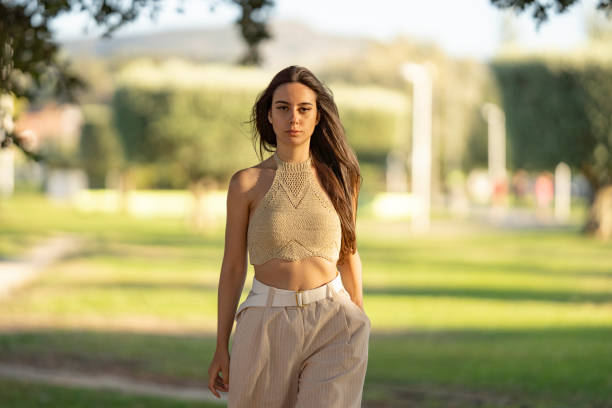 istock Young woman looking at camera outdoors 2177305846
